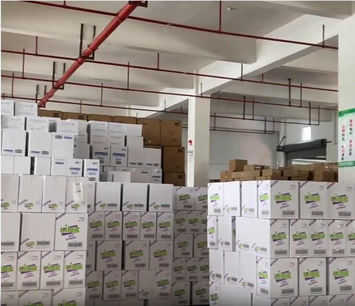 Aluminum pan cartons staged in factory warehouse