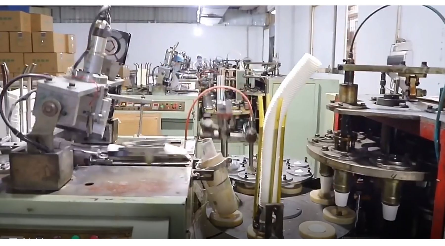 Paper cup production machinery inside supplier factory